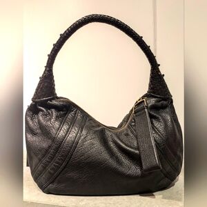 Beautiful slightly worn leather purse not sure of the make but it georgeous!